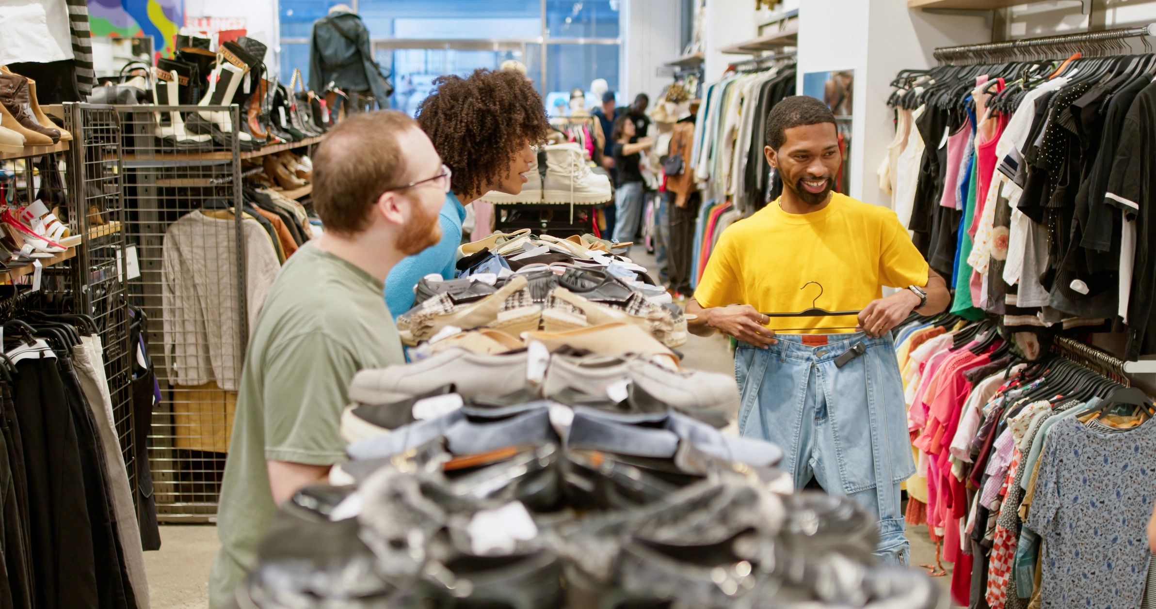 Friends shopping together in a stylish clothing store
